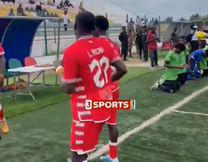 Players of Asante Kotoko walked backwards to the field