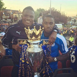 Leicester's Schlupp and Amartey with the EPL trophy