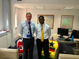 16-year-old Gerald Mensah of Accra Academy with Iain Walker, British High Commissioner