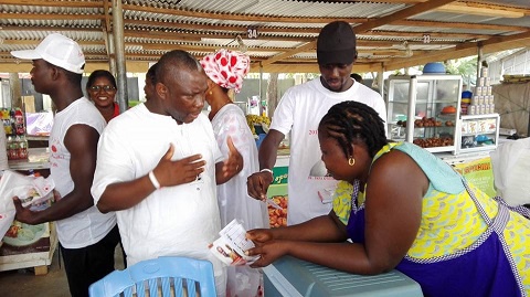 PPP Parliamentary candidate William Dowokpor interacting with some traders at the Santana market