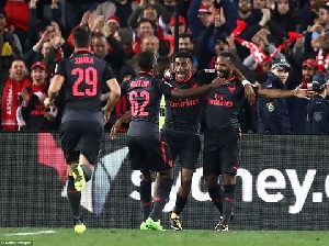 Eddie Nketiah celebrating with some Arsenal players