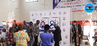 PRESEC headmistress, Lady Queene Asiedu-Akrofi with the clergy unveiling the 80th anniversary logo