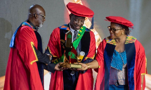 Alex Apau Dadey receiving his honours