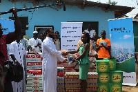 staff of Karpower presenting the items to Muslims at Tema New Town