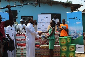 staff of Karpower presenting the items to Muslims at Tema New Town