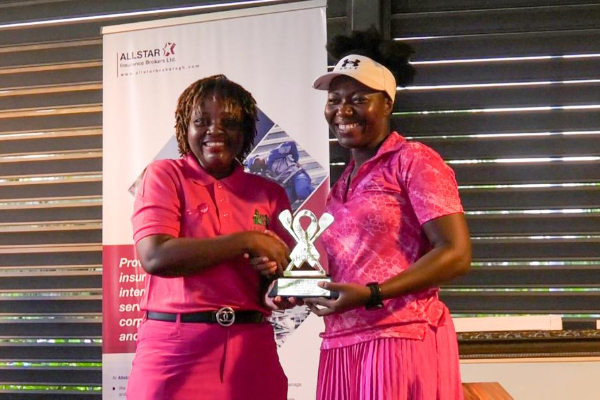Charity Vogel ( R) receiving her winner’s trophy from Kous Louanges Mang