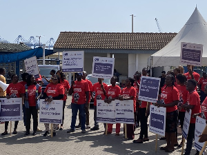 Some demonstrators wielding placards