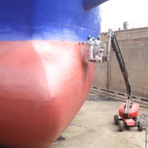 Workers of Tema Shipyard Limited working on a vessel in the drydock