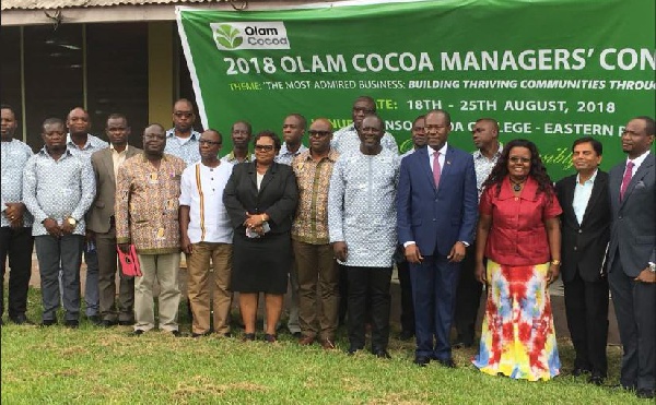 Olam officials in a group photo with COCOBOD CEO, Mr Boahen Aidoo