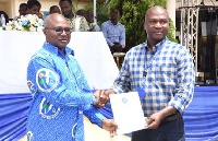 Dr Kingsley Ahenkora (left) presenting a certificate to one of the trainees