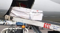The body of Atsu being loaded onto a Turkish Airline flight