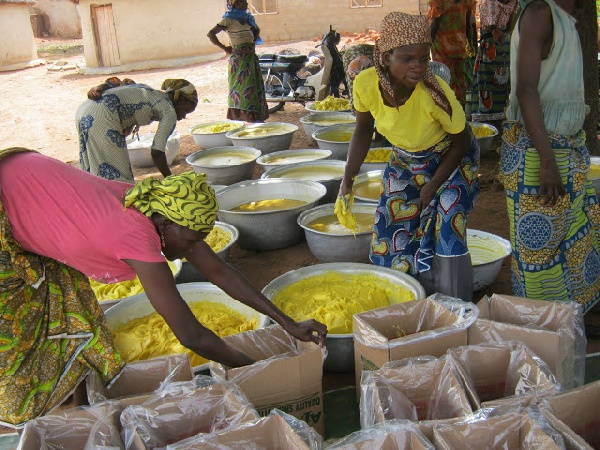 Shea butter producers making the cream