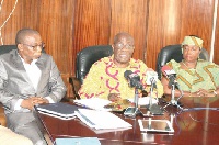Board Chairman of the Mineral Commission, Mr Samson K. Boafo (middle) addressing the media