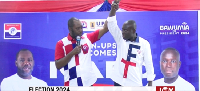 Dr. Matthew Opoku Prempeh holding Robert's hands