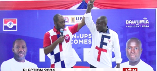 Dr. Matthew Opoku Prempeh holding Robert's hands