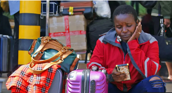 Passengers pictured queuing outside the airport on Wednesday morning