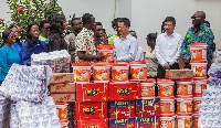 Sunda International Ghana Limited and Twyford Ceramics make donations while the MP looks on