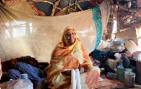 Fatima Cheikh Bouya, one of hundreds of Mauritanians who work in the tourism sector, waits for guest