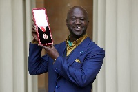Sir David Adjaye poses after he was Knighted by the Duke of Cambridge