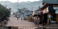 Civilians walk after returning to their homes following displacement during renewed clashes