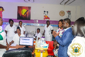 The Minister of Health among some of the health workers during his visit