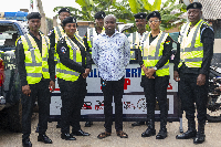 Raymond Addai Danquah with some police officers