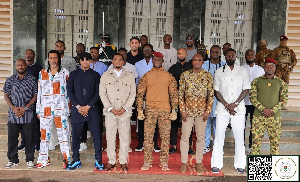 Captain Traore (M) with some African football legends