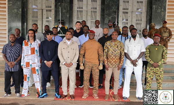 Captain Traore (M) with some African football legends