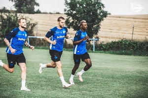 Patrick Twumasi with some team members at the training ground