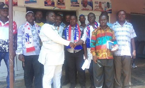 Amoah Yawson (left) welcoming the defectors into the NPP