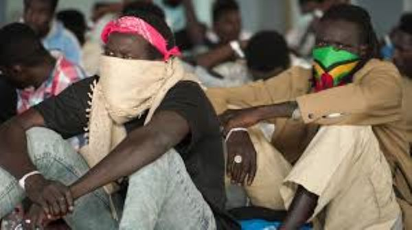 People arriving from North Africa are held in Crete before being moved to the Greek mainland