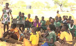 Some students of Amenga-Etego Primary School in their 'classroom'