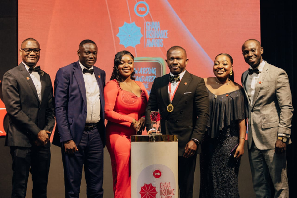 Dr Elton Fredrick Afari and his team with the award