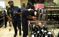 File photo: Officials of the GRA inspecting items in a shopping mall