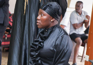 Afia Pokua kneeling before chief and elders at the Manhyia Palace