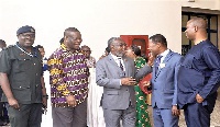 Dr Anthony Nsiah Asare interacting with Dr Samuel Yaw Annor
