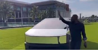 Kwame Despite waving to people just after stepping out of his Tesla Cybertruck