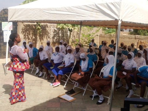 Matilda Chireh  addressing girls in front of CDA-Ghana Office in Wa