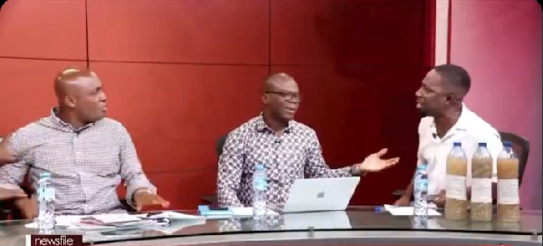 Miracles Aboagye (R) trading words with the Akwatia MP (L)