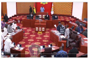 Members of Parliament observing a minute's silence for victims of the crash