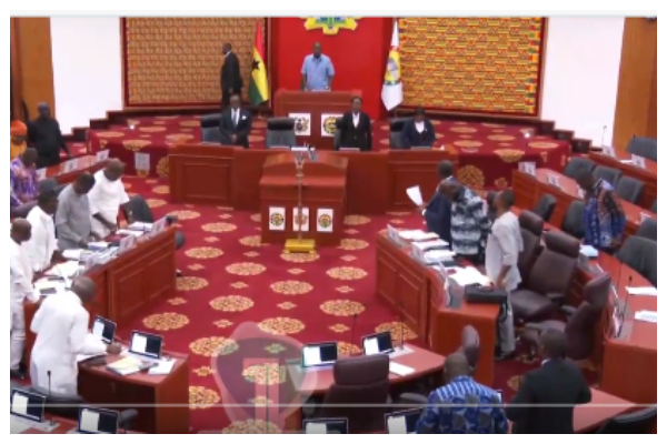 Members of Parliament observing a minute's silence for victims of the crash
