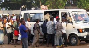 File photo of policemen passengers struggling for a car