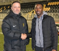 Darius Osei with a club official