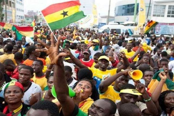 Ghanaians jubilating with the national flag and blowing vuvuzelas