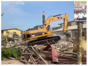 An excavator working at the site of the building collapse