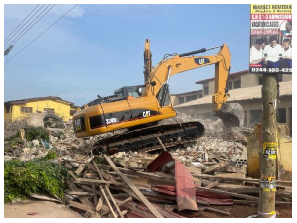 An excavator working at the site of the building collapse
