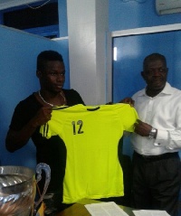 Ahmed Toure during the signing of his deal