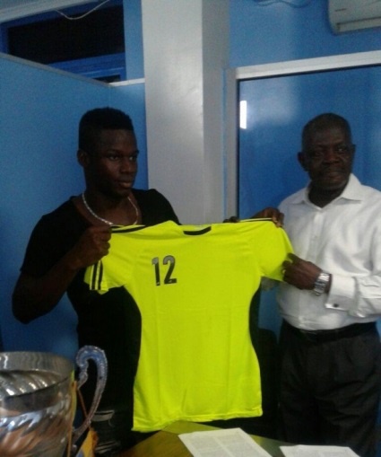 Ahmed Toure during the signing of his deal