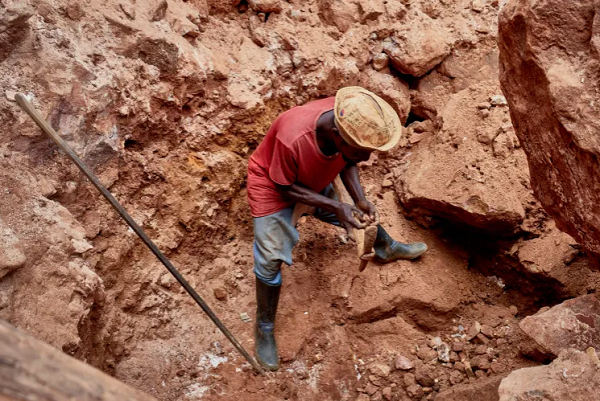 A Congolese artisanal miner digs in an open-pit mine, in Mangaredjipa near Beni