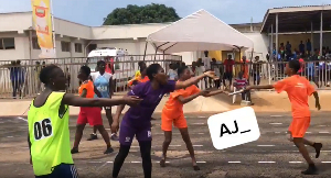 An image of baton exchange during relay during high school athletics